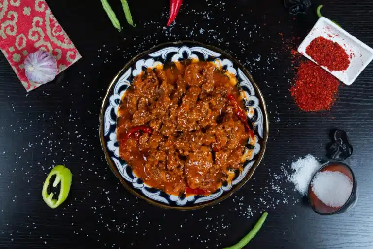 A simmering pot of Olive Garden's meat sauce, showcasing the rich blend of tomatoes, ground beef, and Italian herbs.