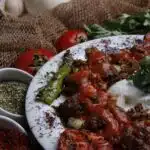 A side-by-side comparison of pasta sauce and marinara sauce in two bowls, highlighting their unique colors and textures.