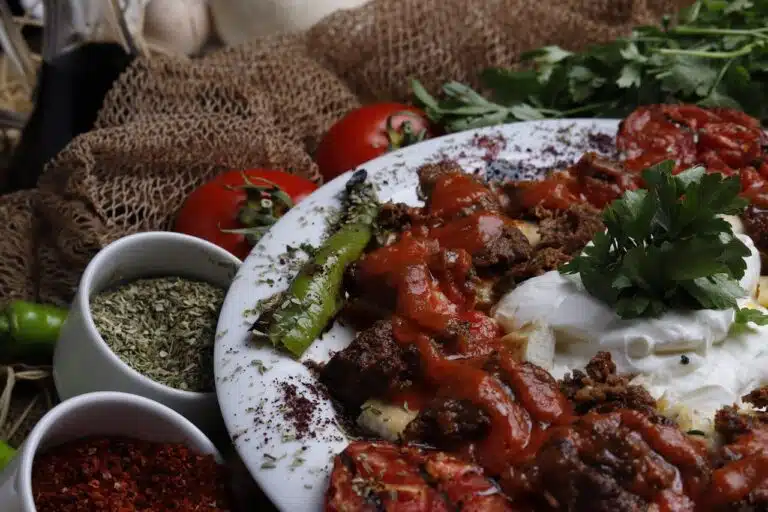 A side-by-side comparison of pasta sauce and marinara sauce in two bowls, highlighting their unique colors and textures.