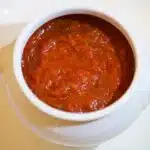 A bowl of spaghetti with marinara sauce, showcasing a healthier pasta sauce option.