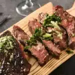 Juicy bavette steak grilled to perfection, served on a cutting board