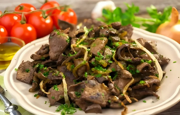 A succulent beef liver steak sizzling on a hot skillet, ready to be served.