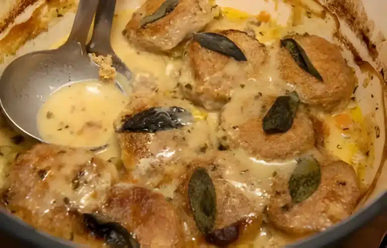 A delicious homemade chicken cobbler topped with golden biscuits, served in a rustic baking dish.