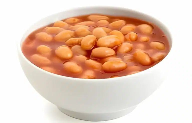 A bowl of cooked navy beans ready to be added to various dishes