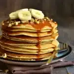 Fluffy pancakes on a plate, inspired by Cracker Barrel, served with syrup and butter on top