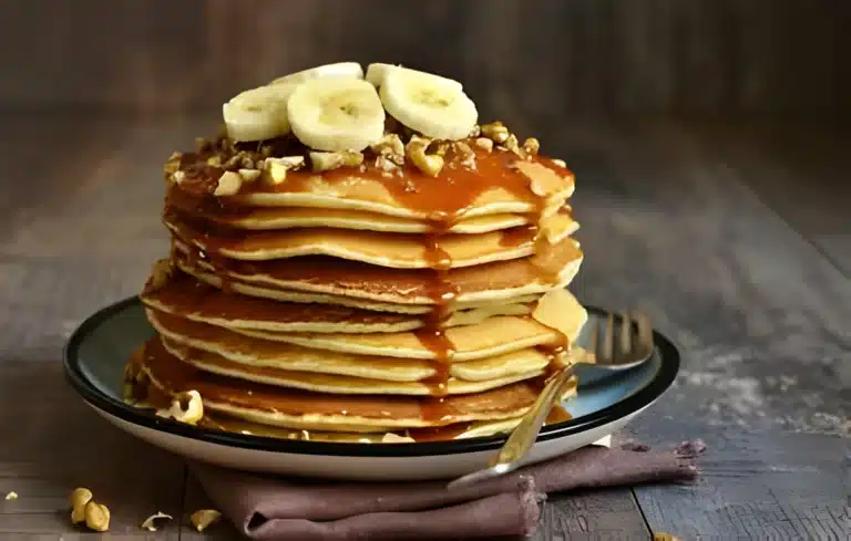 Fluffy pancakes on a plate, inspired by Cracker Barrel, served with syrup and butter on top