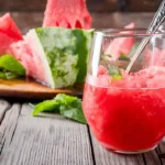 Delicious homemade slushie in a glass with a colorful straw 🥤