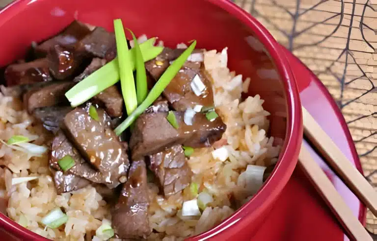 A delicious serving of steak fried rice, featuring tender steak pieces and vibrant vegetables mixed with perfectly cooked rice.