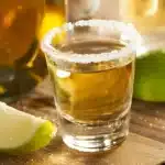 Assortment of tequila shots ready to serve, with lime and salt on the side